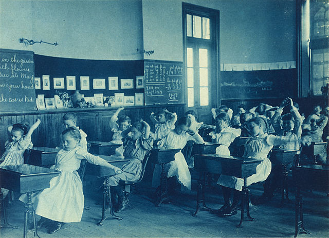 Frances_Benjamin_Johnston,_Schoolgirls_doing_calisthenics,_ca._1899